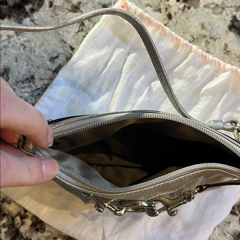 Coach Silver leather wristlet. Pre-Owned Condition-Very Good. - Picture 9 of 9